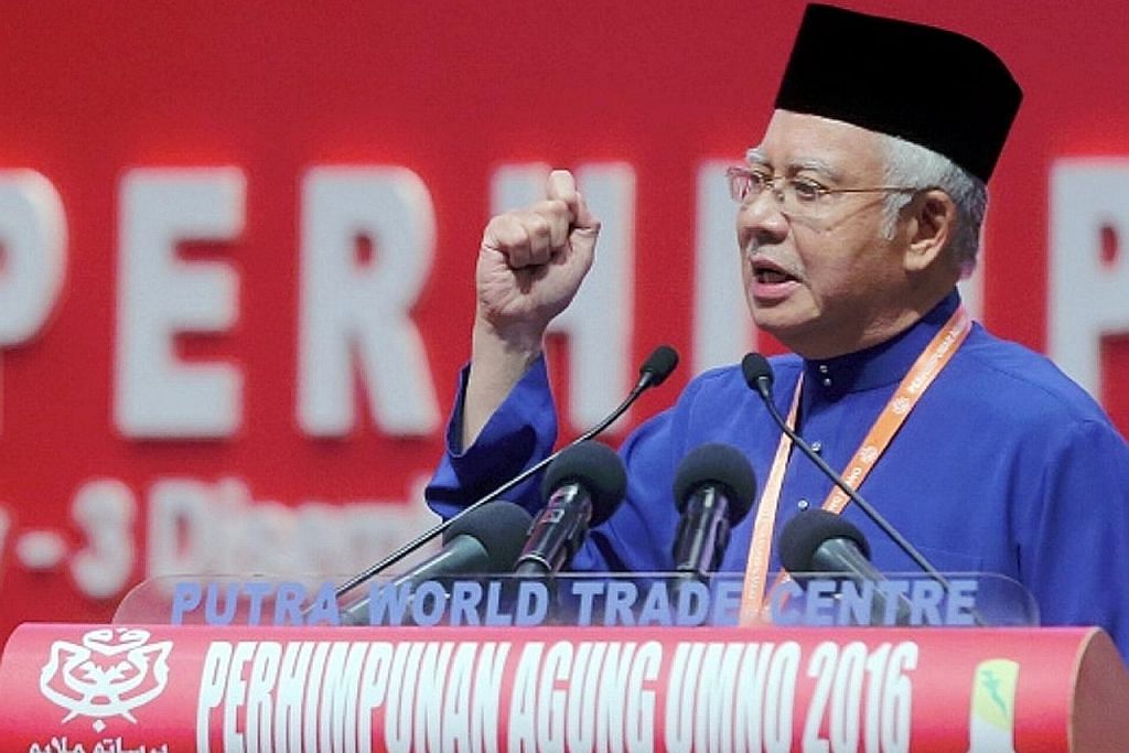 PERHIMPUNAN AGUNG UMNO Najib kecam Dr M; ingatkan akan bahaya jika parti kaum lain berkuasa