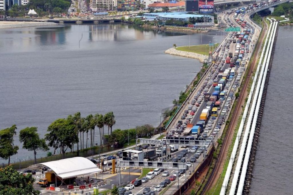 3-hour customs queues as travellers head across Causeway for Chinese New Year